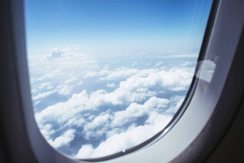 a view of the sky through an airplane window, travel guide, fan favorite, sky blue, 1 2 9 7