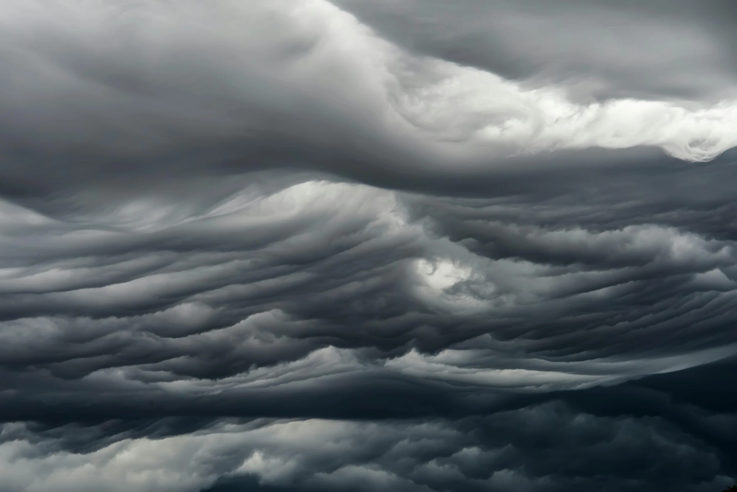 a black and white photo of a cloudy sky, by Alison Geissler, baroque, national geographic photo award, ultra detailed storm clouds, colorful dramatic puffy clouds, undulating nebulous clouds