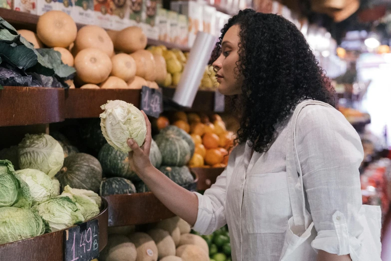 a woman shopping for vegetables in a grocery store, a screenshot, by Nicolette Macnamara, pexels, renaissance, australian, tessa thompson, essence, fan favorite