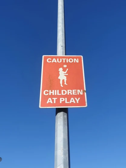 a red and white sign on a metal pole, kids playing, high level of detail, very very precise, no nudity