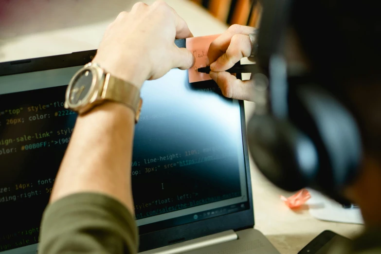 a person sitting in front of a laptop computer, pexels, hacking into the mainframe, scrolling computer mouse, teaching, thumbnail