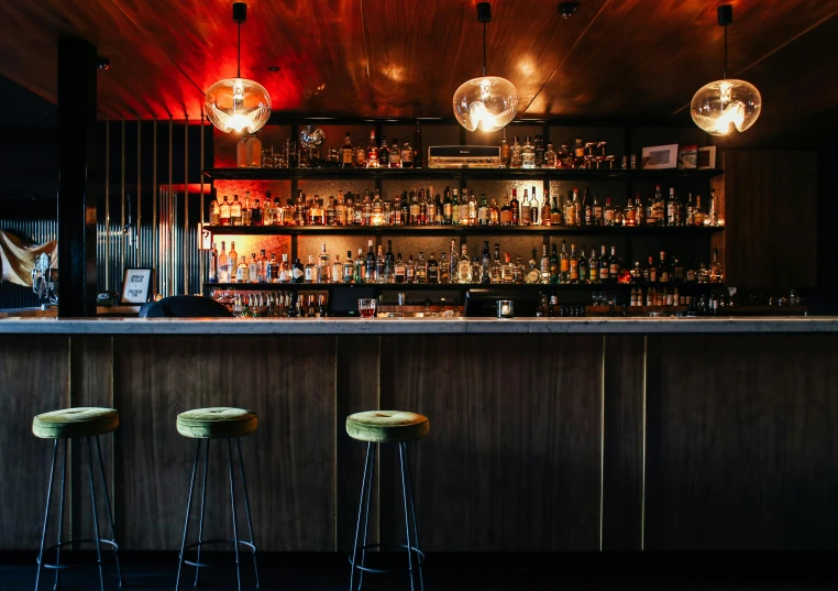 a couple of stools sitting in front of a bar, a portrait, unsplash, speakeasy, in chippendale sydney, panoramic, slightly minimal