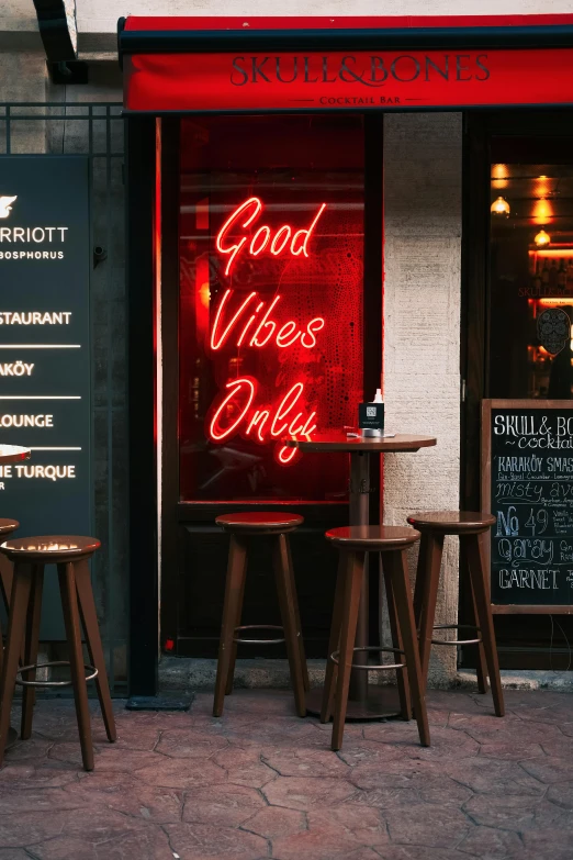 a restaurant with a neon sign that says good vibes only, pexels contest winner, alcohol, starbucks, spiritual vibes, urban surroundings