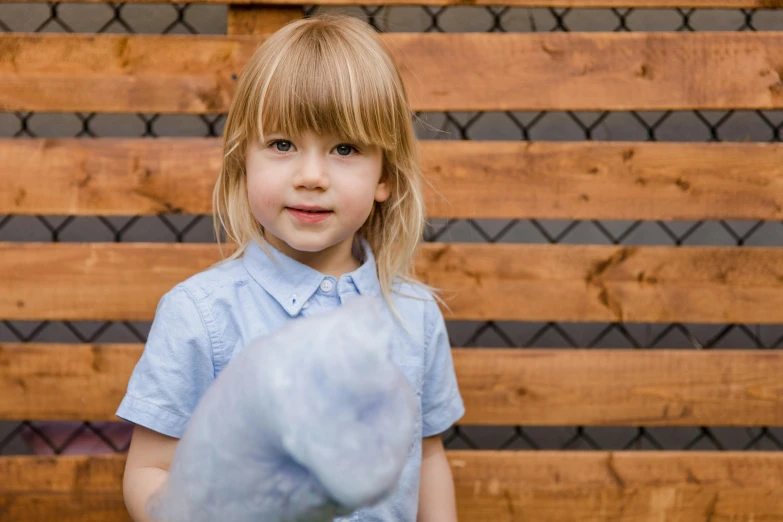 a little girl holding a blue teddy bear, a picture, pexels contest winner, made of cotton candy, adventure playground, ash thorp, ready to model