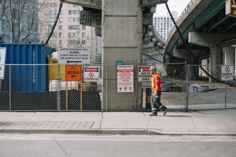 a person riding a skateboard on a city street, a photo, pexels contest winner, constructivism, giant road sign armor champion, toronto, construction site, under bridge