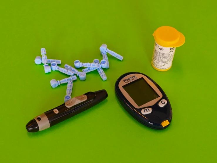 a close up of a device on a table, by Meredith Dillman, pexels, dau-al-set, vials, cane, obese ), green