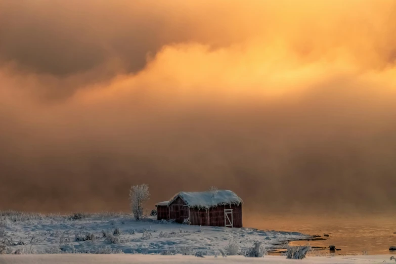 a red barn sitting on top of a snow covered field, by Harald Giersing, pexels contest winner, romanticism, water mists, golden clouds, light inside the hut, grey