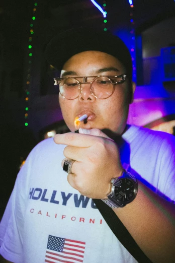 a man that is holding a cigarette in his hand, an album cover, inspired by Eddie Mendoza, unsplash, extremely fat, college party, lesbians, los angeles ca