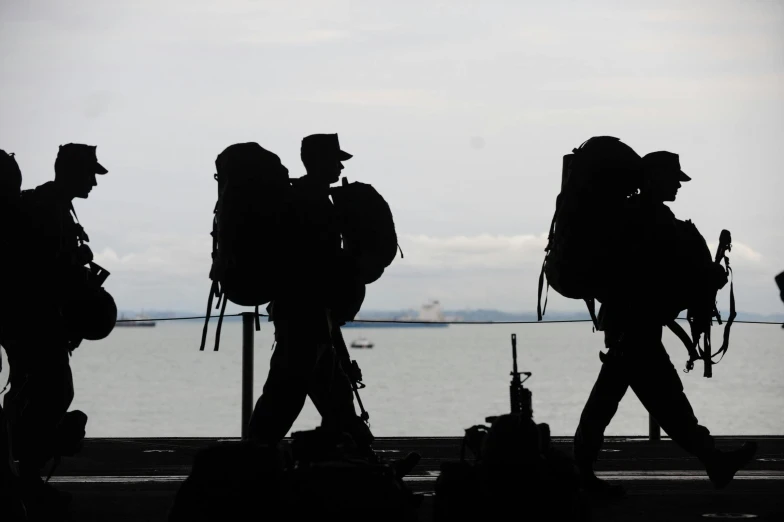 a group of people walking next to a body of water, military boots, silhouetted, avatar image, maintenance