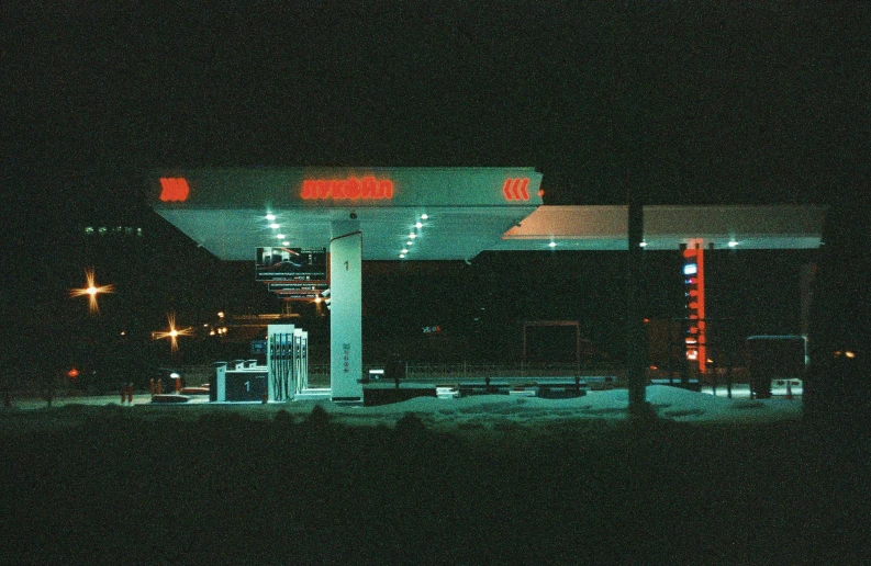 a gas station is lit up at night, a polaroid photo, pexels contest winner, brutalism, lo fi, album cover, 1 9 9 8 photo, phosphorescent