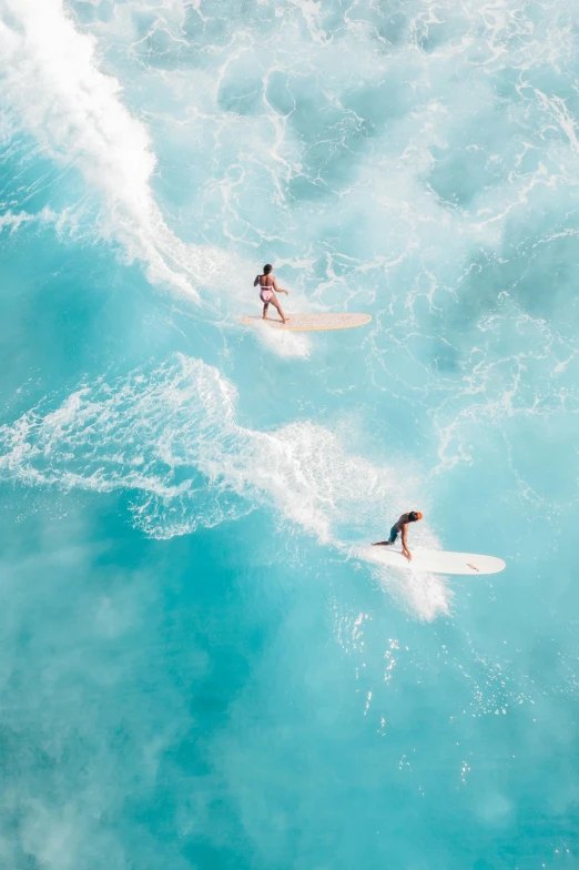 a couple of people riding surfboards on top of a wave, flatlay, in australia, definition, feature