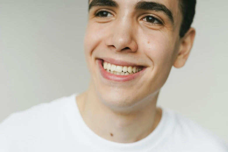 a close up of a person with a tooth brush, pexels contest winner, hyperrealism, smiling male, male teenager, avatar image, large eyebrows