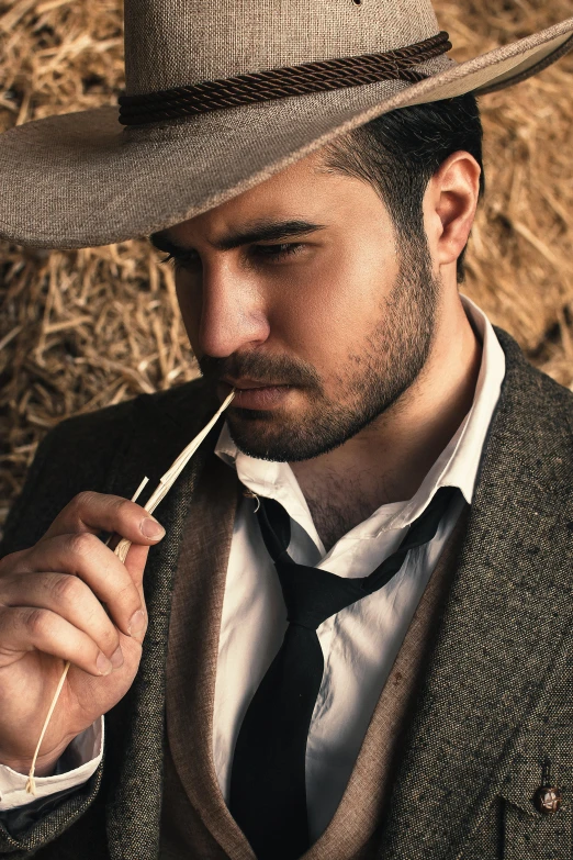 a man in a hat smoking a cigarette, inspired by Ramon Pichot, trending on pexels, renaissance, western cowgirl, wearing hay coat, promo image, stubble