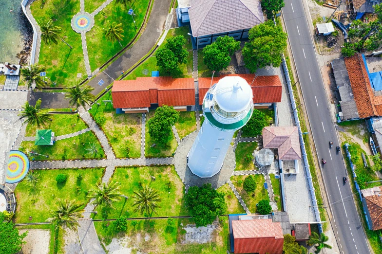 a white light house sitting on top of a lush green field, hurufiyya, topview map, thumbnail, museum photo, background image