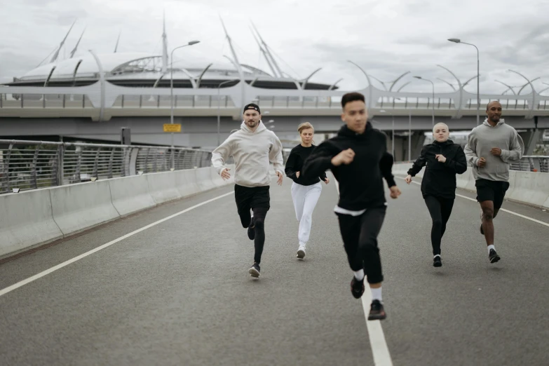 a group of people running across a bridge, federation clothing, profile image, squad, blank