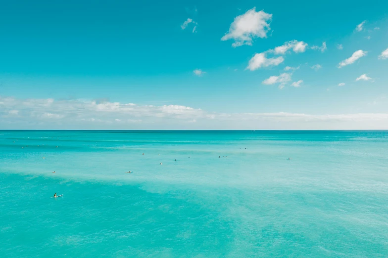 a large body of water with people in it, unsplash contest winner, minimalism, varadero beach, cyan colors, no words 4 k, waikiki beach skyline