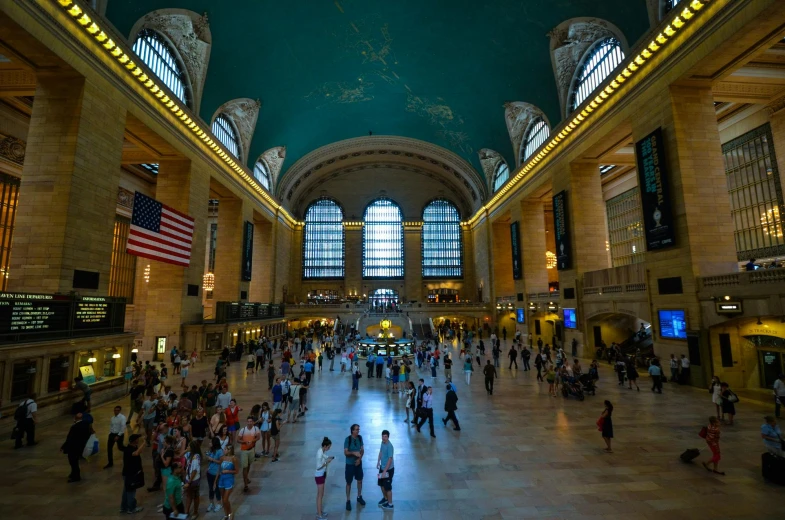 a large room filled with lots of people, by Alison Geissler, pexels contest winner, train station in summer, in the middle of new york, thumbnail, a green
