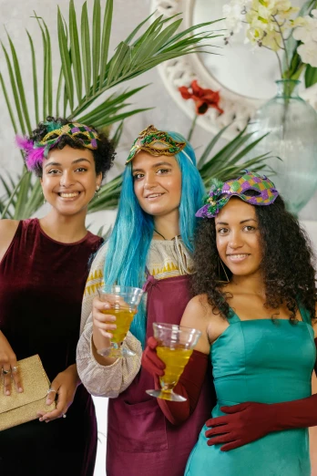a group of women standing next to each other holding wine glasses, teal headband, persian queen, tropical, multicoloured