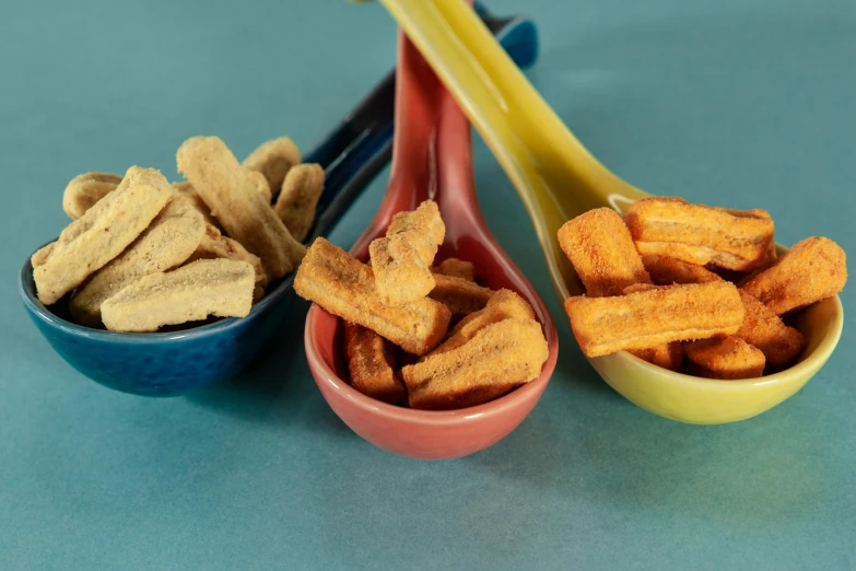 a close up of three small bowls of food, inspired by Doug Ohlson, rainbow coloured rockets, cinamtic, crisps, thumbnail