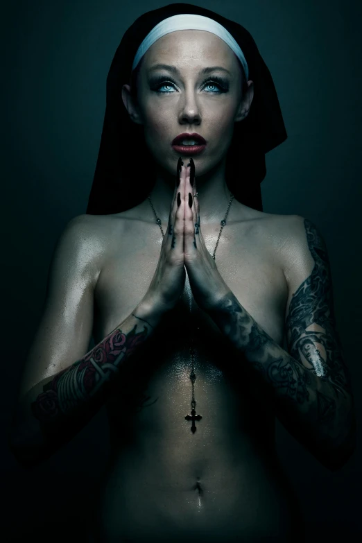 a woman with tattoos and a cross on her chest, inspired by Hedi Xandt, gothic art, praying meditating, 5 0 0 px models, album cover, extremely moody blue lighting