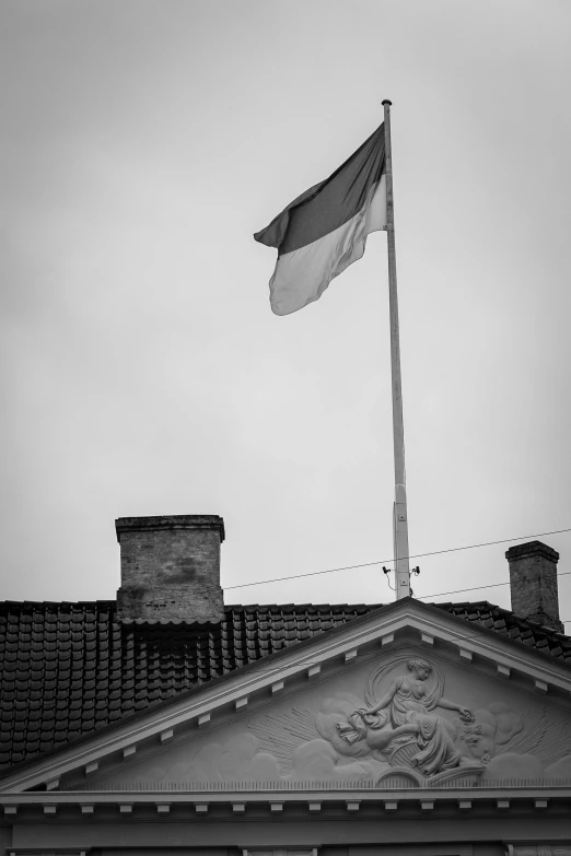 a black and white photo of a flag on top of a building, inspired by Mihály Munkácsy, f/4.5, tallinn, square, epiphany