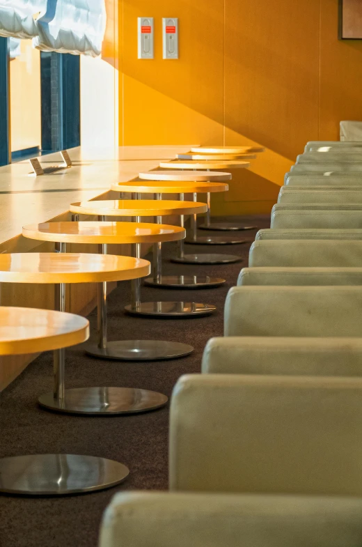 a row of chairs sitting next to each other in a room, food court, grand library, afternoon light, dan mumfor