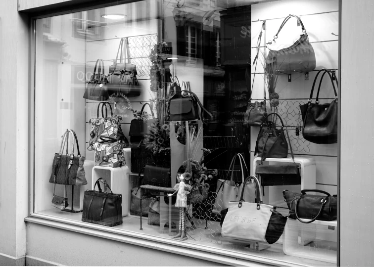 a store window filled with lots of handbags and purses, a photo, by Miroslava Sviridova, pixabay, figuration libre, blanco y negro, large windows to french town, unimaginably huge, accurate portrayal