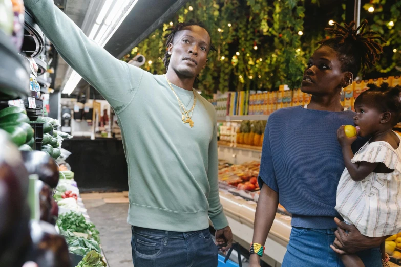 a man standing next to a woman in a grocery store, pexels, happening, kehinde wiley, chief keef in the garden of eden, behind the scenes photo, avatar image