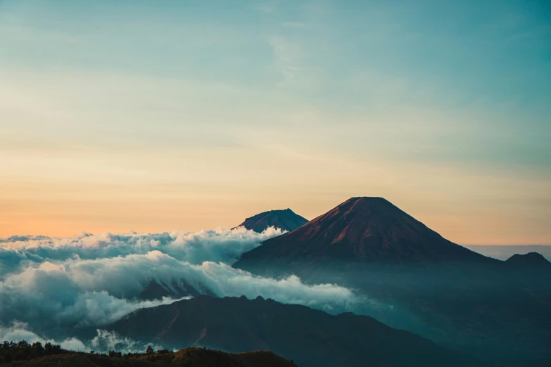 a mountain that has some clouds in it, pexels contest winner, sumatraism, avatar image