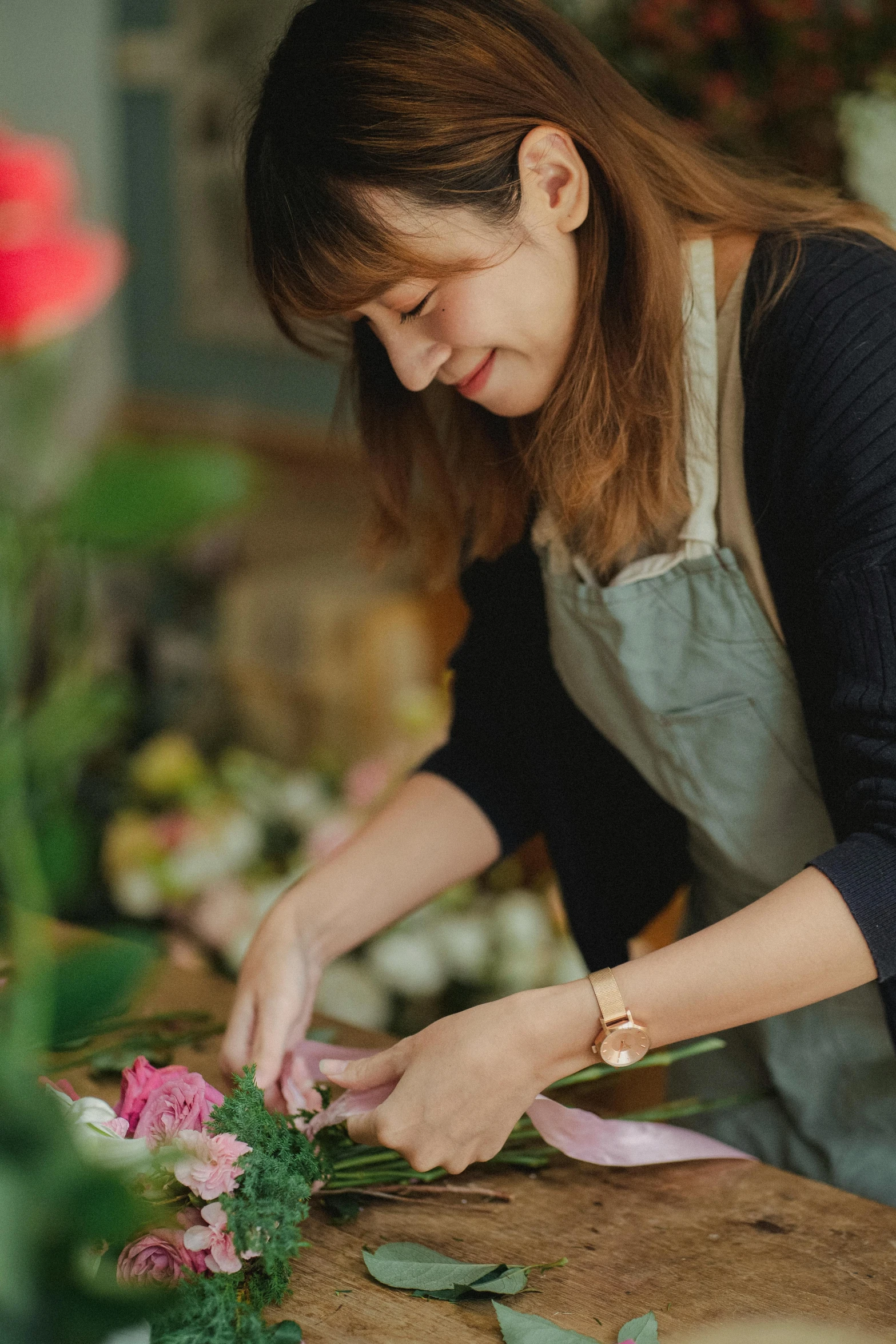 a woman is working in a flower shop, a picture, by Jessie Algie, trending on unsplash, renaissance, low detail, rosa bonheurn, plating, masking