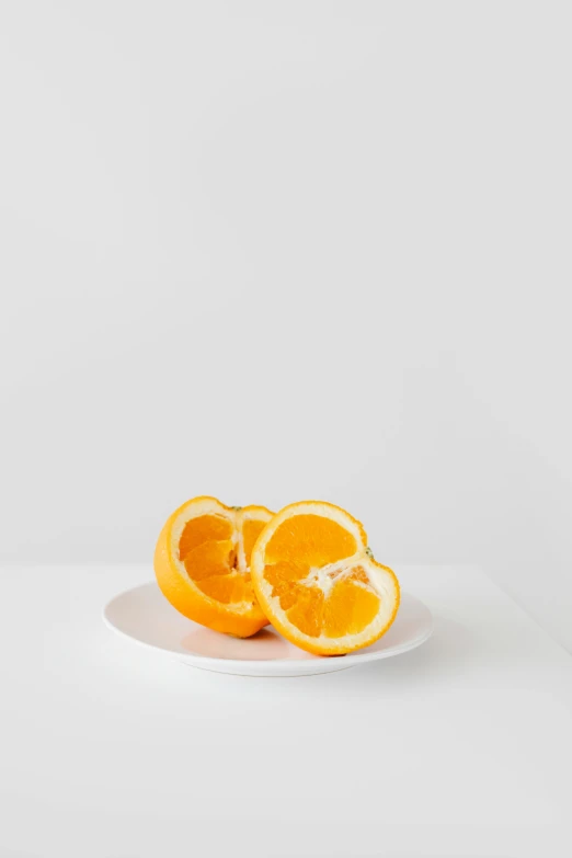 an orange cut in half on a plate, unsplash, with a white background, focus on full - body, crisp lines, mild