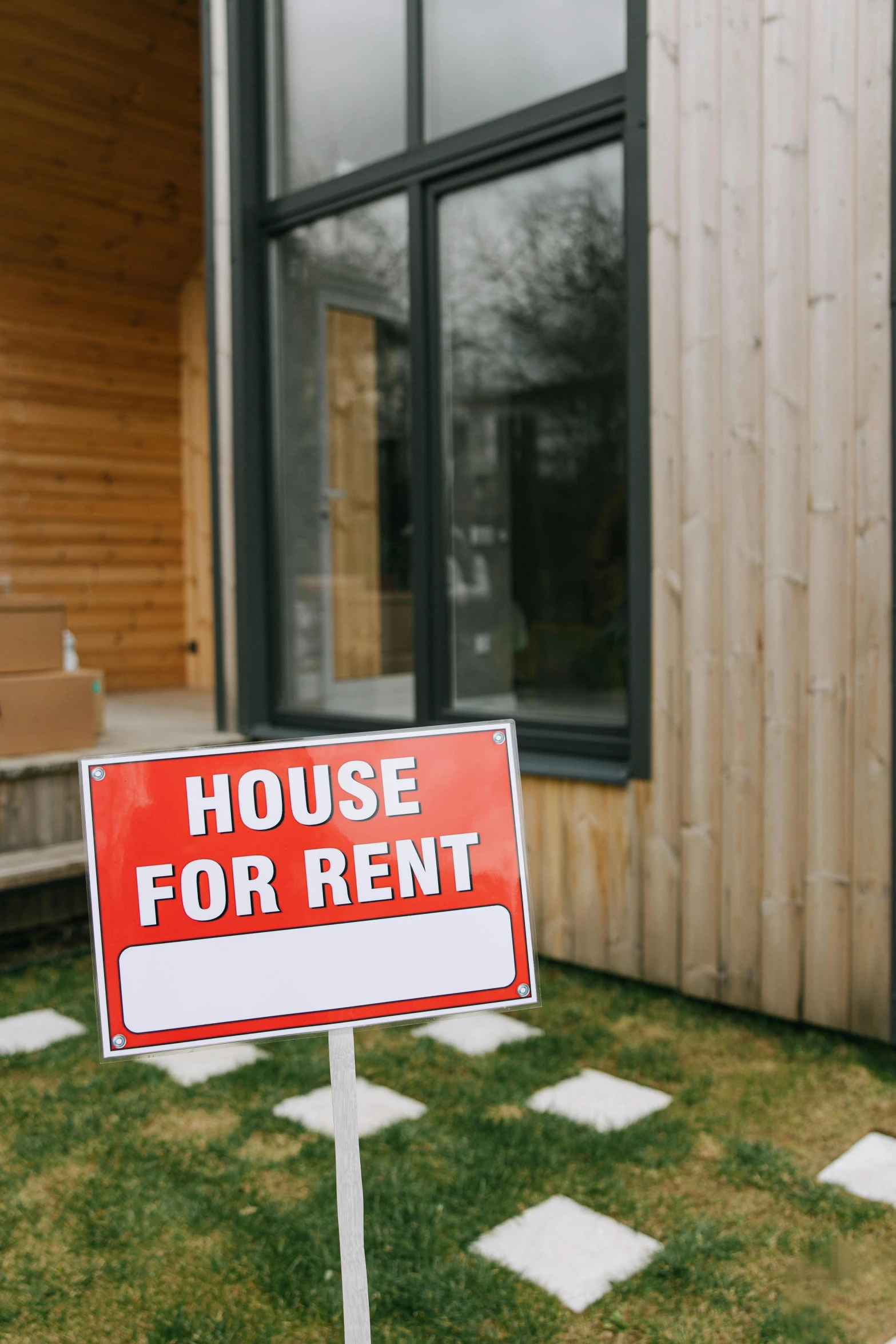 a house for rent sign in front of a house, shutterstock, modernism, instagram post, tiny house, studio photo, octane renter