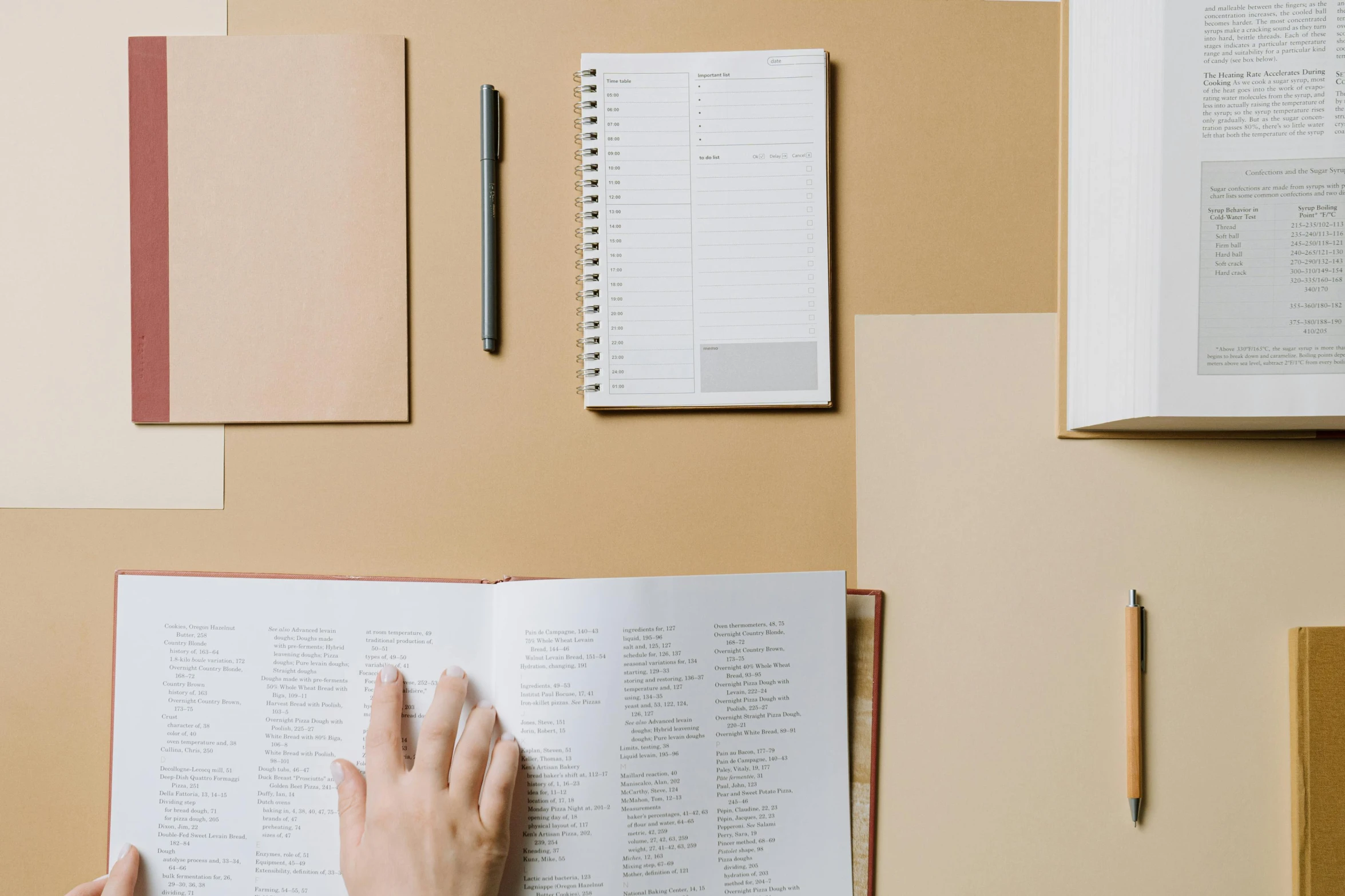 a person is reading a book on a desk, trending on unsplash, academic art, light - brown wall, inspect in inventory image, a list cast, brown and white color scheme