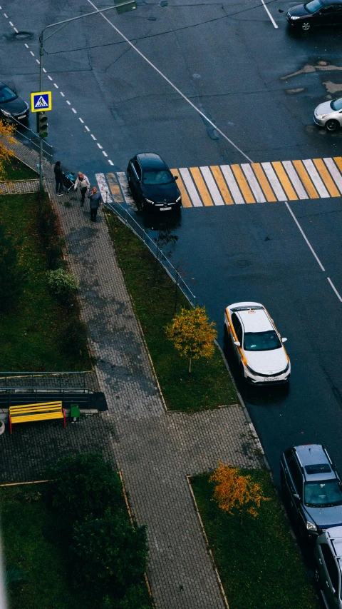 a city street filled with lots of traffic, by Adam Marczyński, pexels contest winner, in a suburb, yellow, drifting around a corner, thumbnail