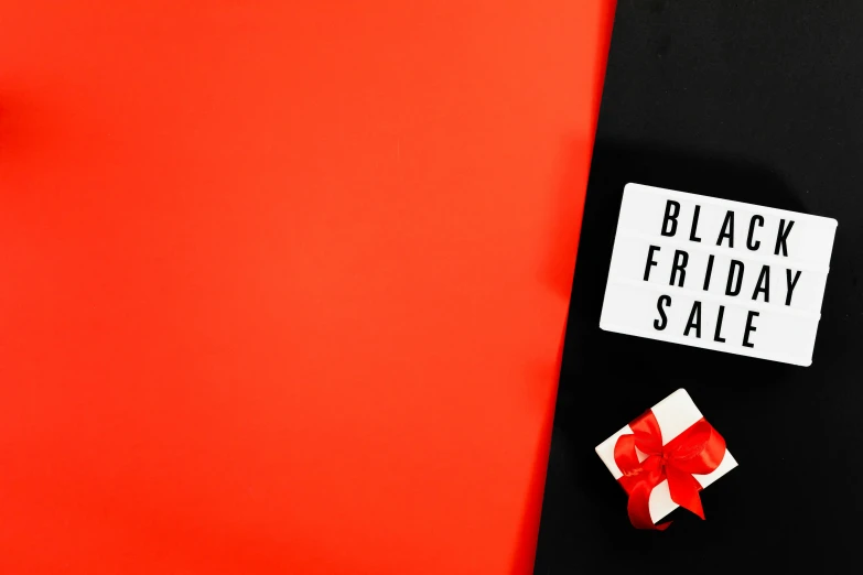 a black friday sale sign next to a gift box, by Julia Pishtar, trending on unsplash, visual art, black and red colour palette, instagram story, black squares on 4 corners, holding a red banner