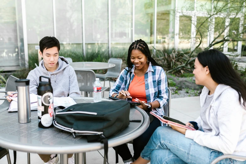 a group of people sitting around a table, at college, digital image, background image, ayne haag