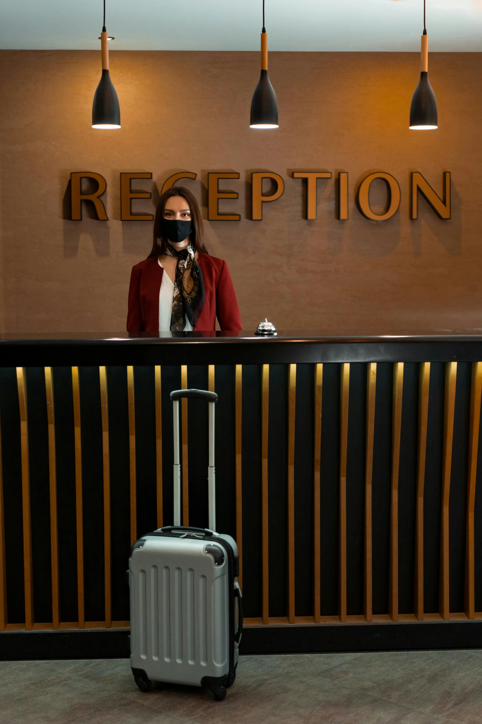 a woman standing in front of a reception desk, happening, mask off, luggage, textured, thumbnail