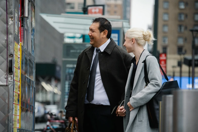 a man and a woman are walking down the street, in new york, coworkers, peter chung, profile shot