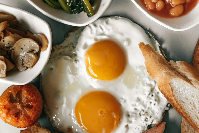 a close up of a plate of food with eggs, a cartoon, trending on unsplash, dau-al-set, background image, hyper realistic photo, jakarta, 2 0 0 0's photo