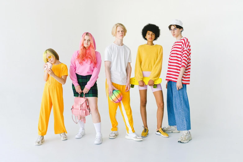 a group of people standing next to each other, inspired by Wes Anderson, maximalism, die antwoord yolandi visser, pink and yellow, teen boy, official store photo