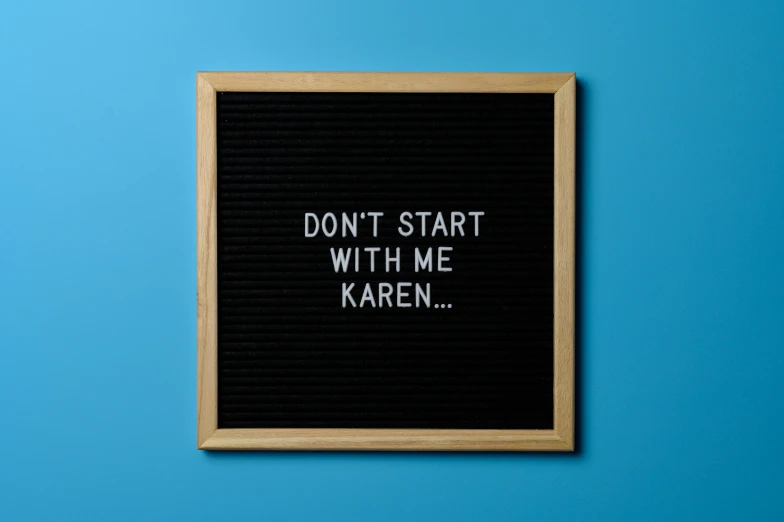 a sign that says don't start with me karen, by Adam Dario Keel, trending on pexels, slate, black, popular on etsy, standings defiantly