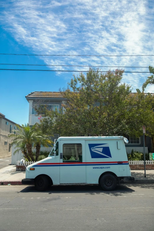 a mail truck parked on the side of the road, an album cover, unsplash, the city of santa barbara, square, summer day, ignant