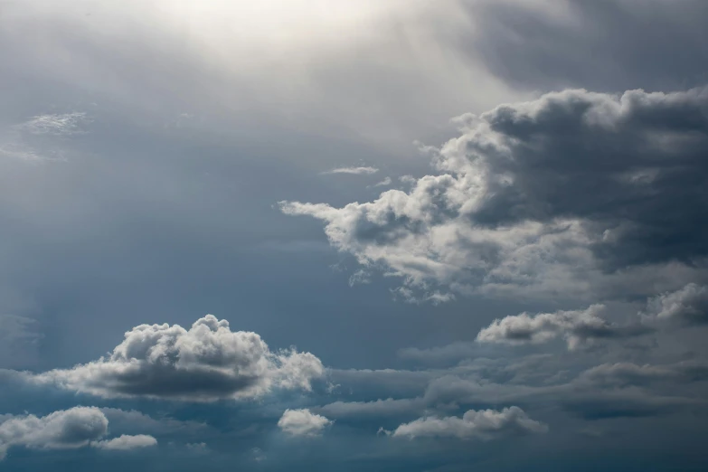 a person flying a kite on a cloudy day, unsplash, minimalism, layered stratocumulus clouds, dramatic lighting - n 9, grey, low angle 8k hd nature photo