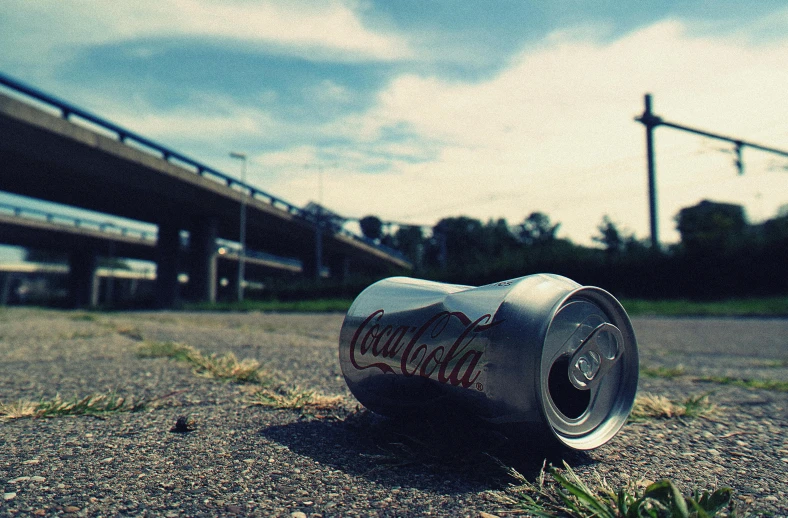 a can of coca sitting in the middle of a road, a picture, unsplash, hyperrealism, trash style, profile picture 1024px, hungover, an abandoned old