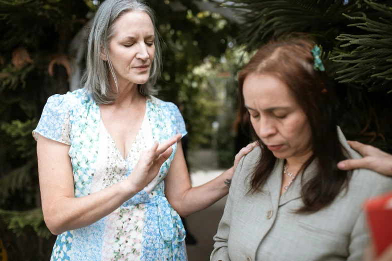 a couple of women standing next to each other, unsplash, paradise garden massage, baptism, exasperated, profile image