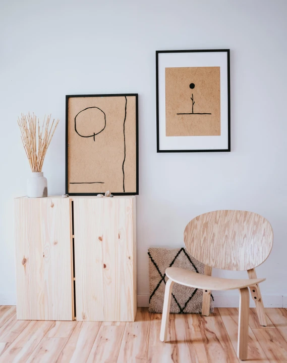 a wooden chair sitting on top of a hard wood floor, a minimalist painting, inspired by Constantin Hansen, pexels contest winner, stick figure, picture frames, dot art on paper, product introduction photo