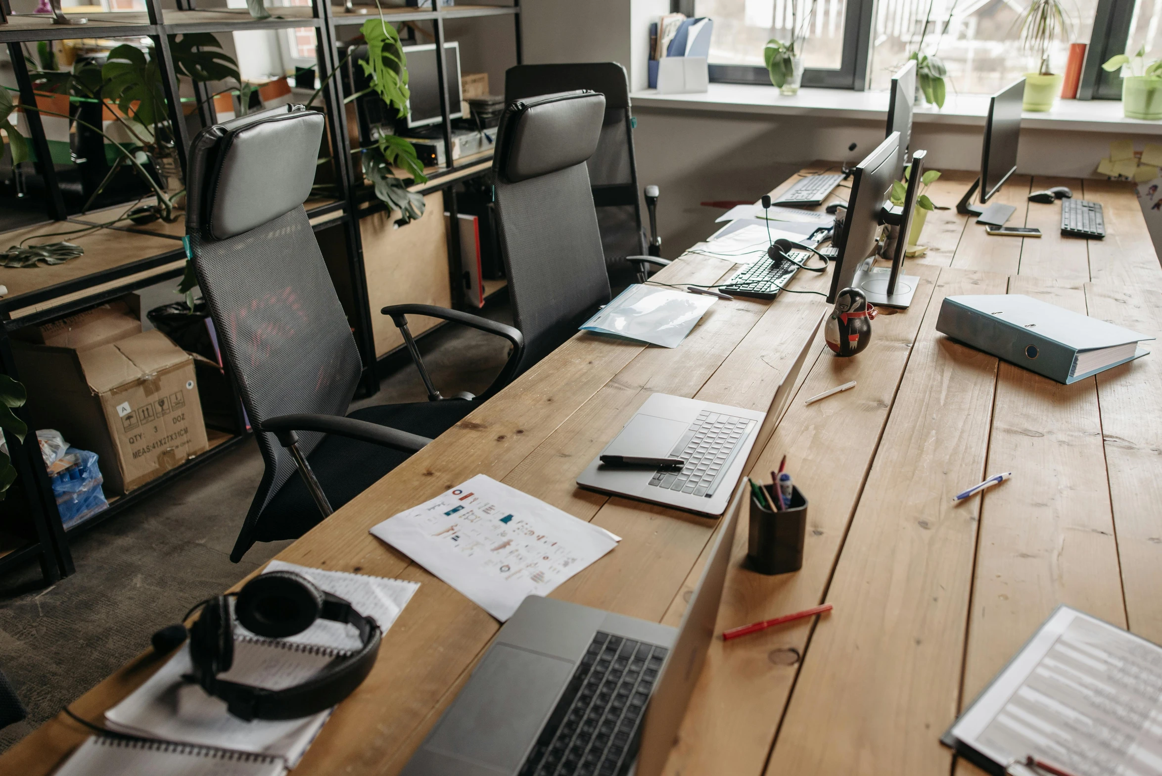 a laptop computer sitting on top of a wooden desk, chairs and tables, thumbnail, sarenrae, the office