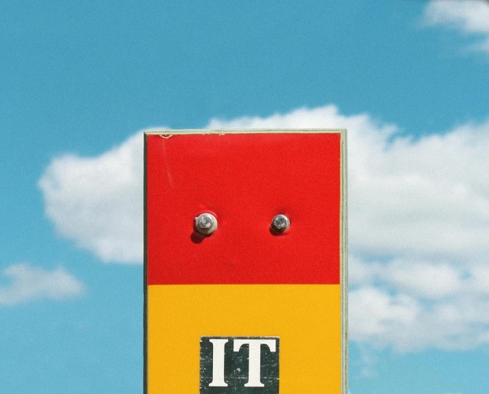a close up of a street sign with a sky background, an album cover, inspired by Rene Magritte, unsplash, yellow and red, holes, mit technology review, on a hot australian day