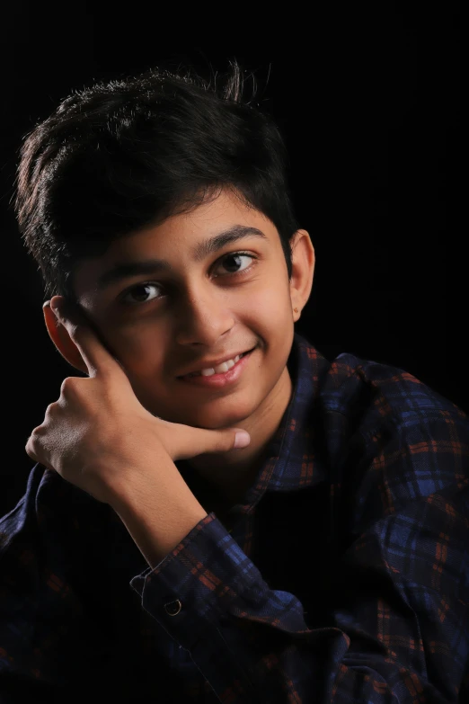 a young boy posing for a picture in front of a black background, by Rajesh Soni, actress, transparent background, profile pic, aged 13