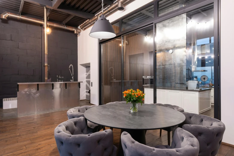 a room that has a table and chairs in it, by Adam Marczyński, unsplash, molten metal house, kitchenette and conferenceroom, 9 9 designs, high ceiling